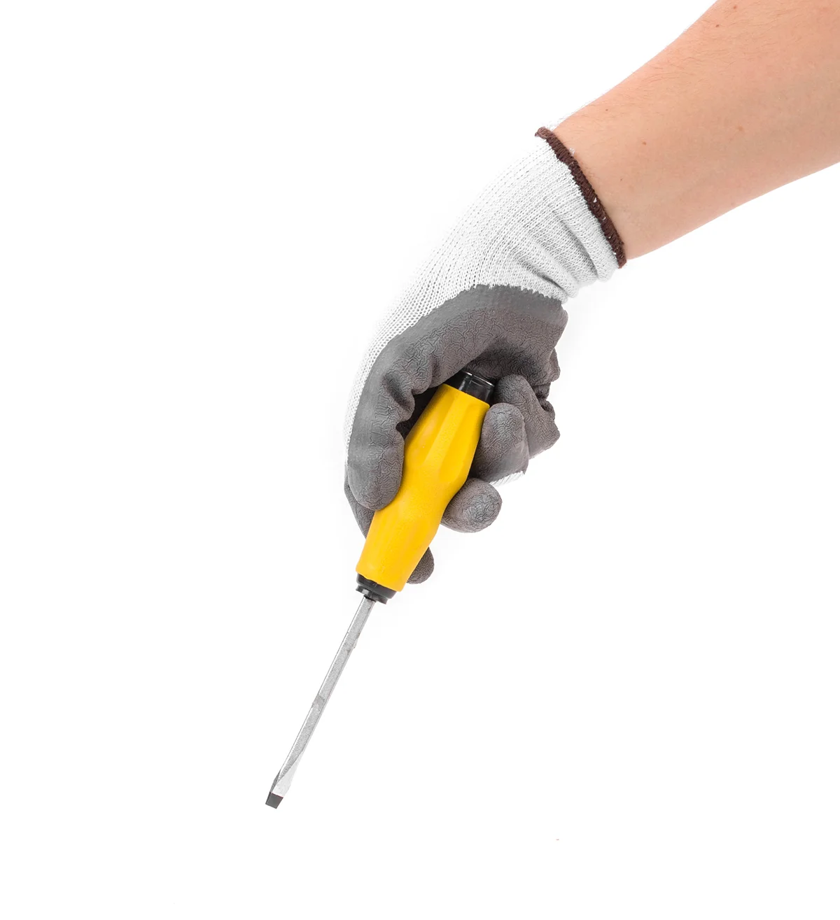 gloved hand holding a screwdriver